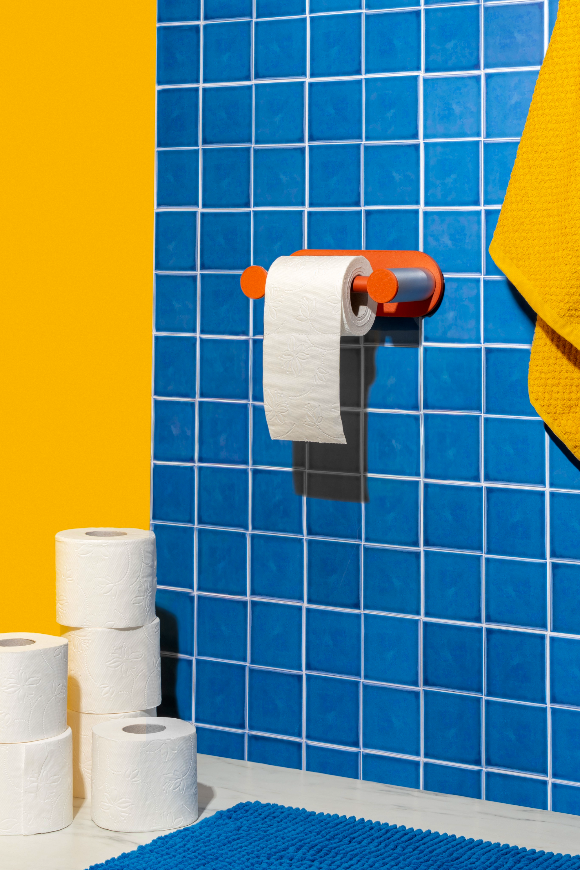 Terracotta Roto in a blue-tile bathroom — vertical